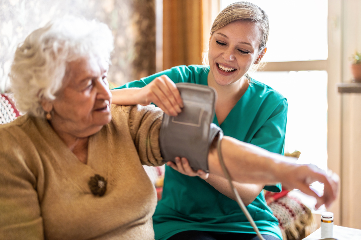 Older woman receiving a senior health screening