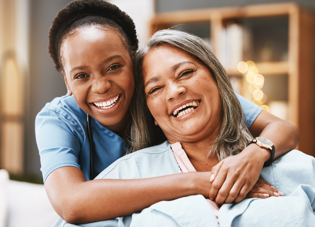 Caregiver or senior healthcare doctor hugging and elderly woman while in senior care