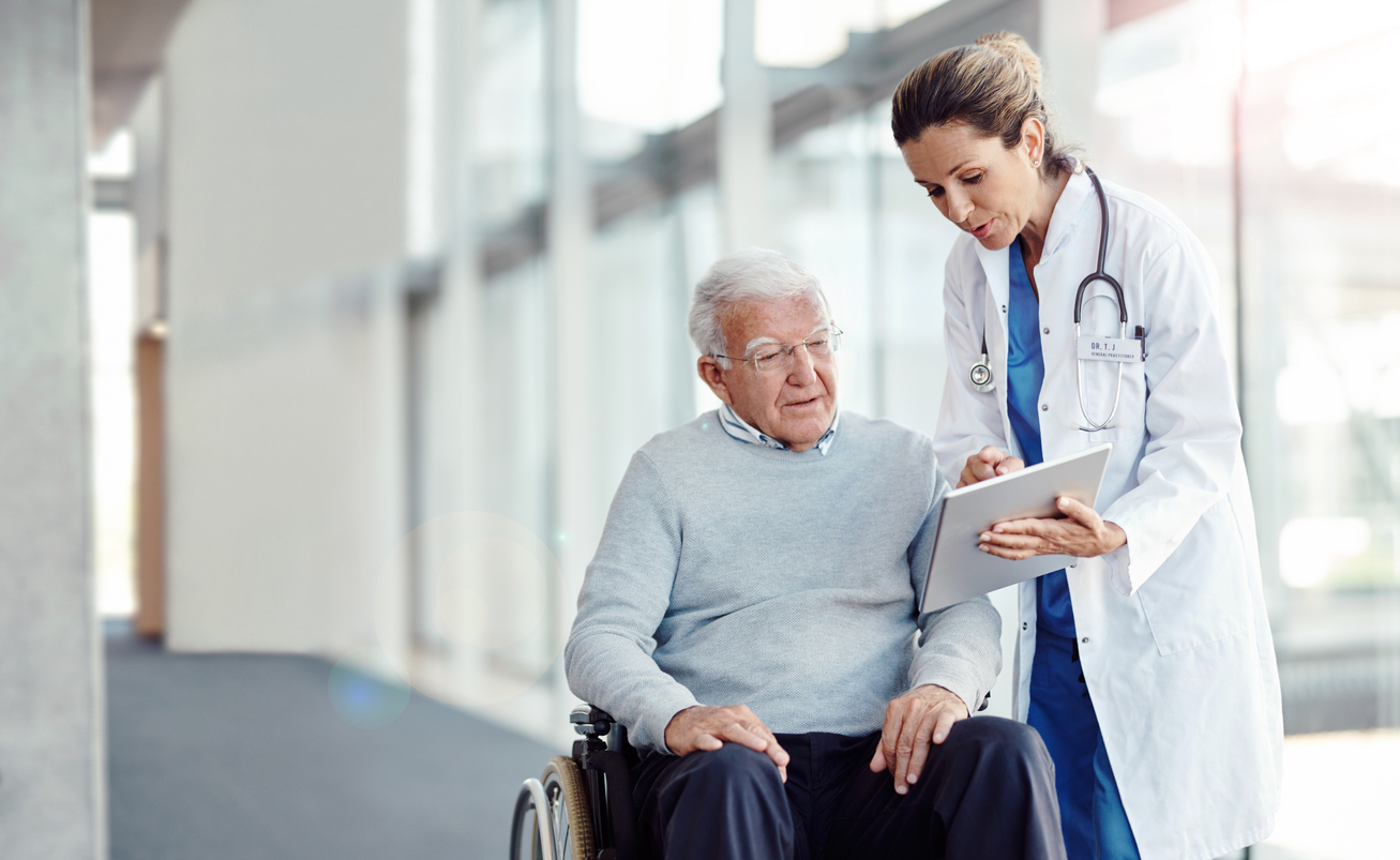 Shot of a doctor showing her senior patient something on a digital tablet